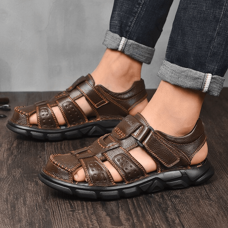Men's genuine leather trekking sandals with soft soles and anti-collision toes, featuring adjustable hook & loop closure for hiking.